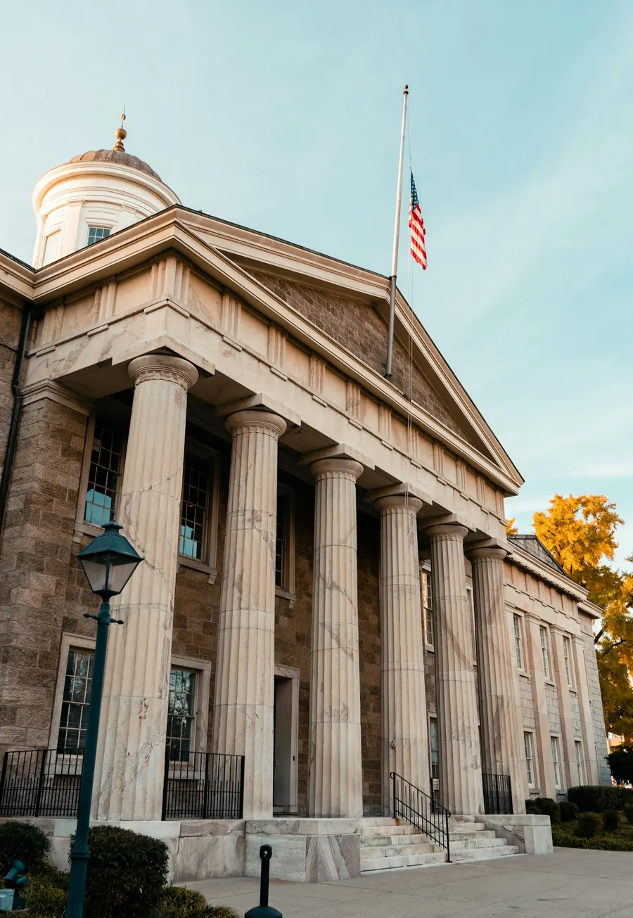 Columned government building with a flag